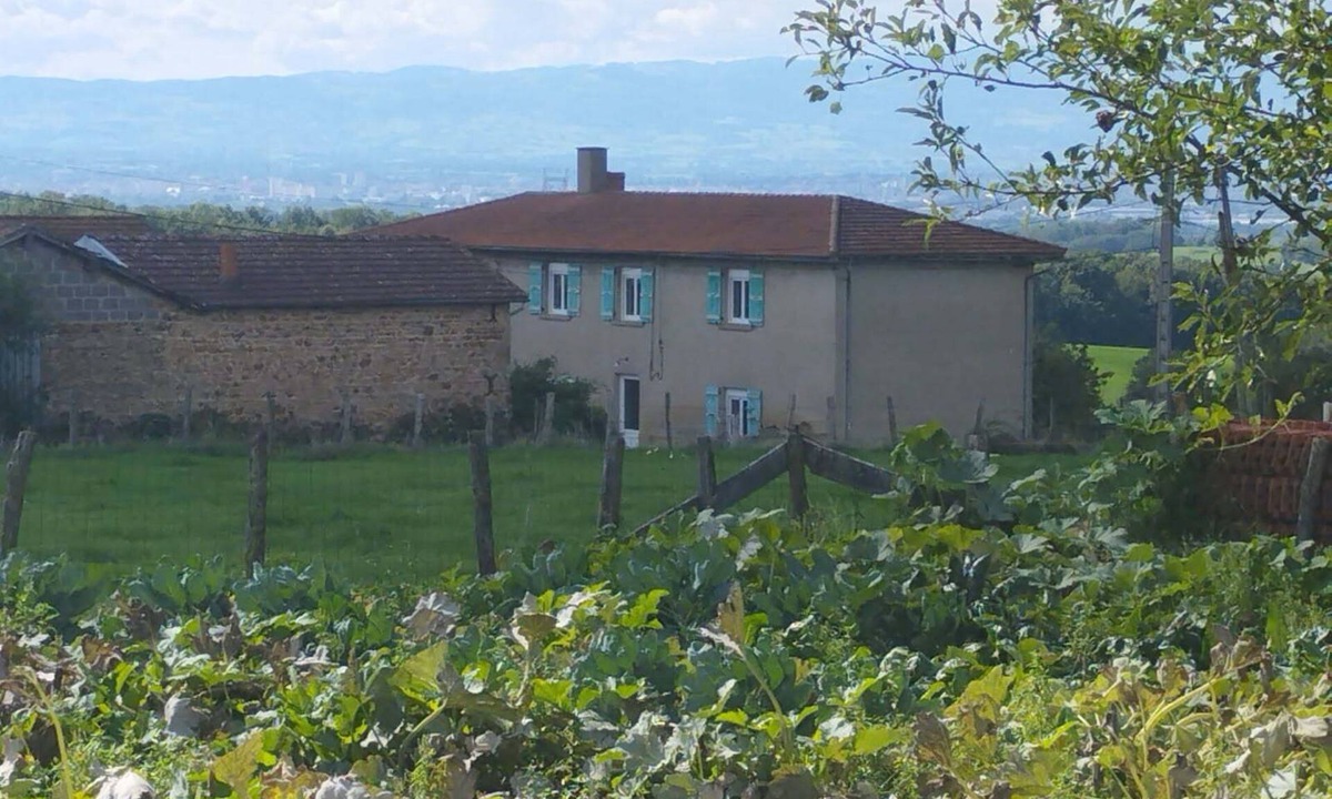 Coutouvre House | Hydrangea farmhouse with views of the surrounding hills