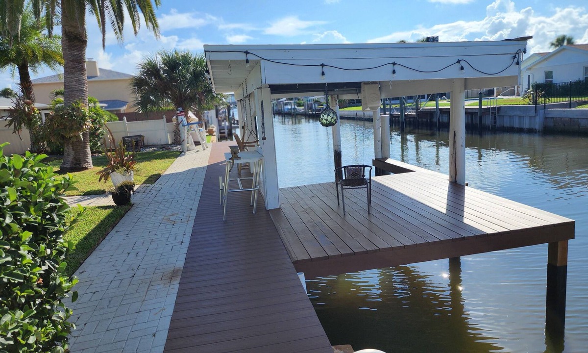 South Daytona House | Intercostal channel house with boat dock and ping-pong table