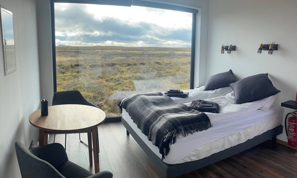 Selfoss Cottage | Panoramic view cabin for 2. Large window, nature & stream