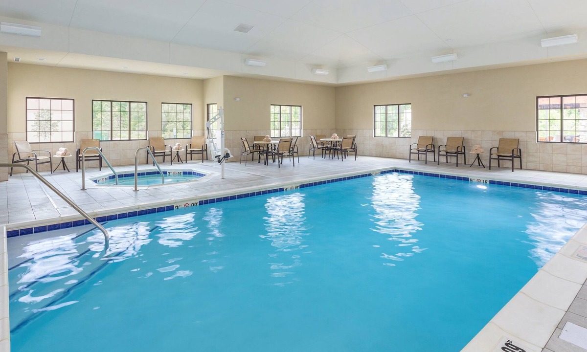 North Canton Condo | King Suite. Free Breakfast Buffet. Pool & Hot Tub Access.