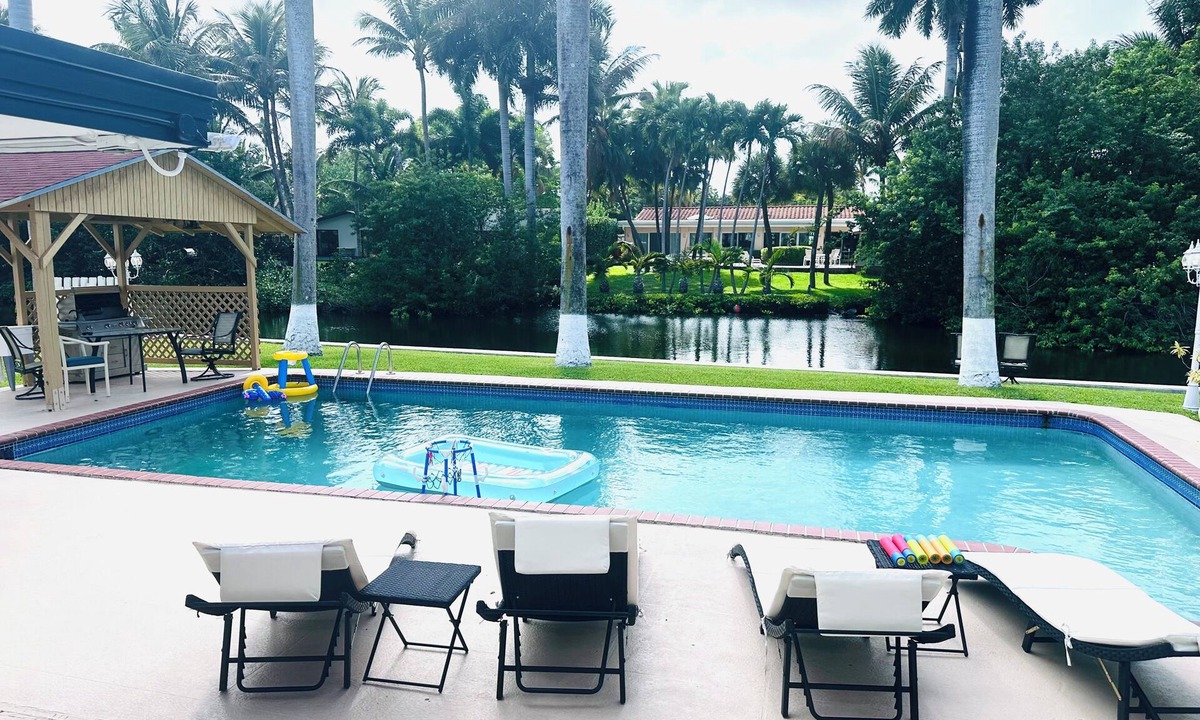 Ojus House | Kosher-Friendly Waterfront house with a pool. 80ft canal.