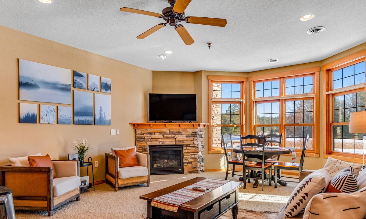 Three Lakes Condo | Lake-view condo with patio, fireplace, hot tubs, pools, firepit, gym, golf & W/D