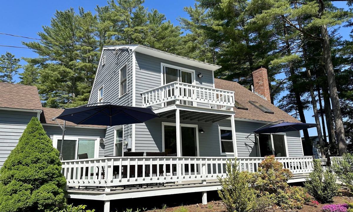 Alton Bay House | Lakefront home with deck, game room, washer/dryer, grill, dock, & views