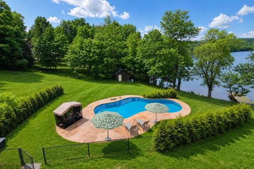 Monroe House | Lakefront Retreat w/Pool & Boats – Sleeps 12