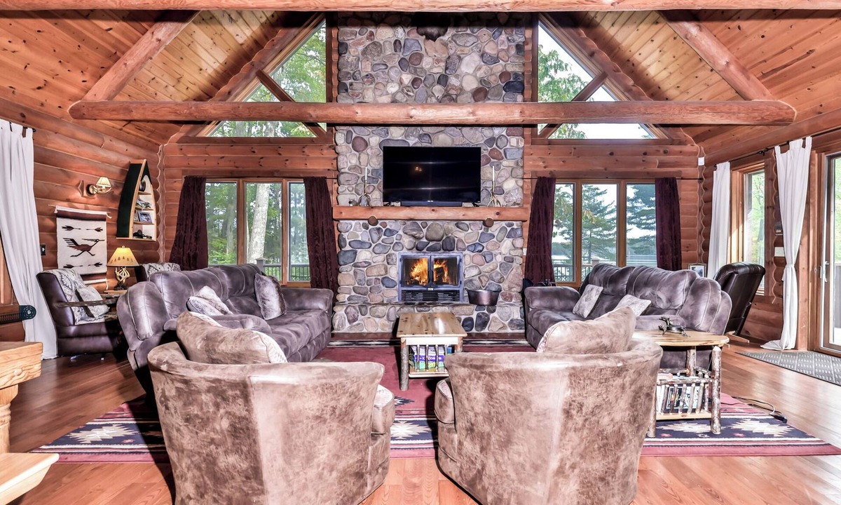 Three Lakes House | Large lakeside log home with air-hockey, foosball, dock, enclosed porch, firepit