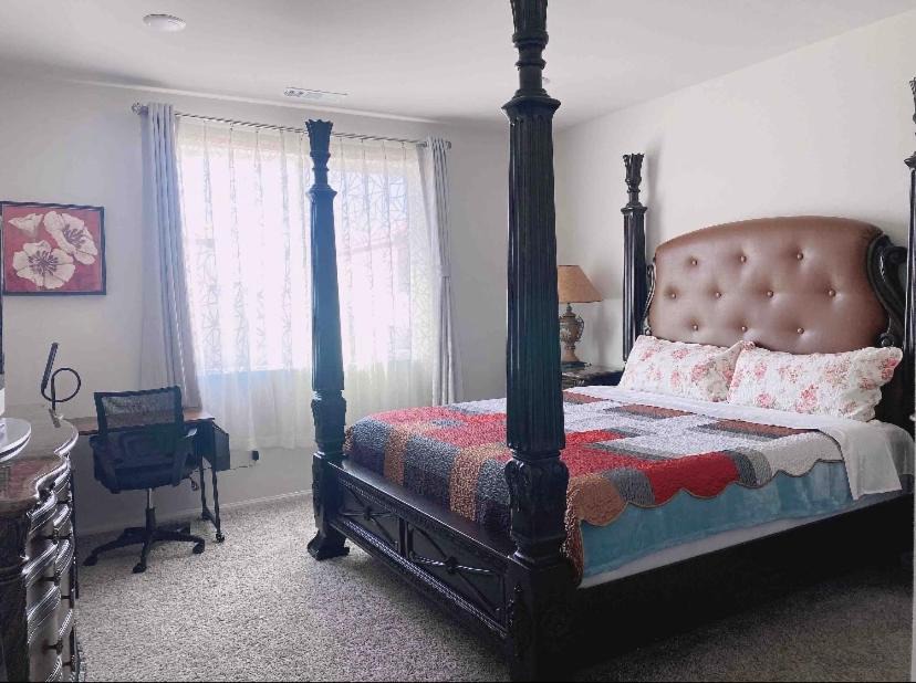 Riverside House | Large master bedroom with Separate bathroom and work desk on the first floor