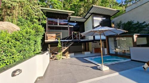 Cafuba House | Loft com piscina, sauna e hidro