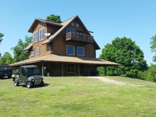 Yellville House | LOG HOME CANINE RETREAT with DOG ART COLLECTION