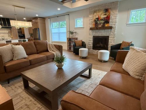 Gastonia House | Luxury New Construction Cottage with fireplace, office, and covered deck