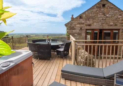 Castle Carrock House | Mill Barn, Castle Carrock, dogs welcome, hot tub with countryside and reservoir views