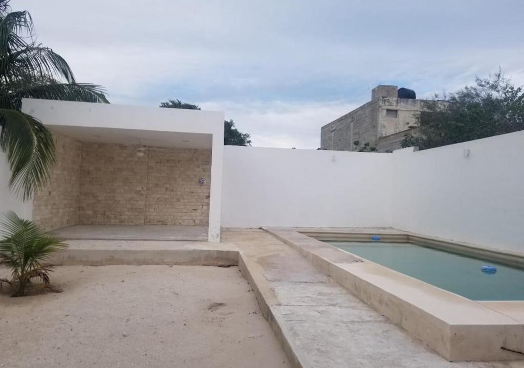 Chicxulub Puerto House | Minimalist house with pool and patio