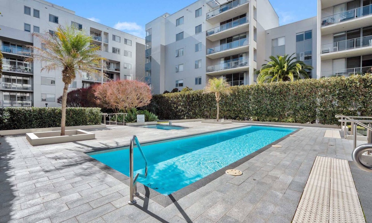 City East Apartment | Modern 1-Bed Unit with Pool Views and Balcony