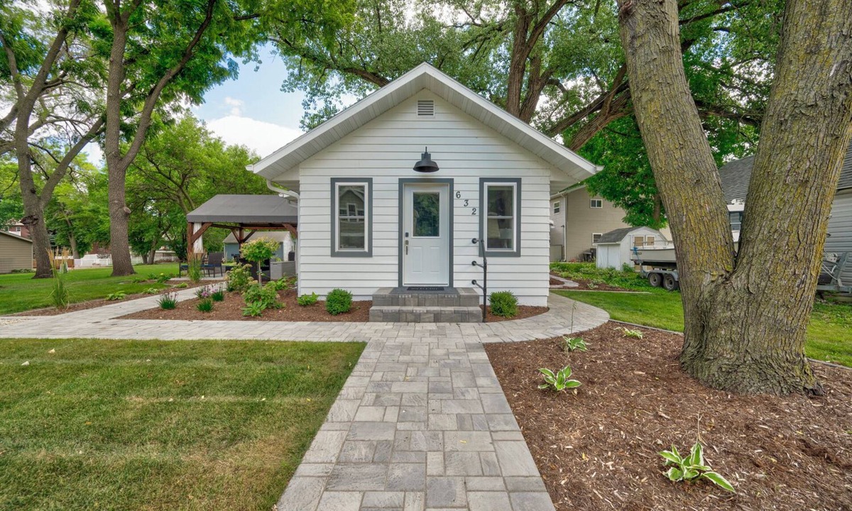 Arnolds Park House | Modern Bungalow Retreat: Walk to Arnolds Park, Relax with Fire Pit & Pergola