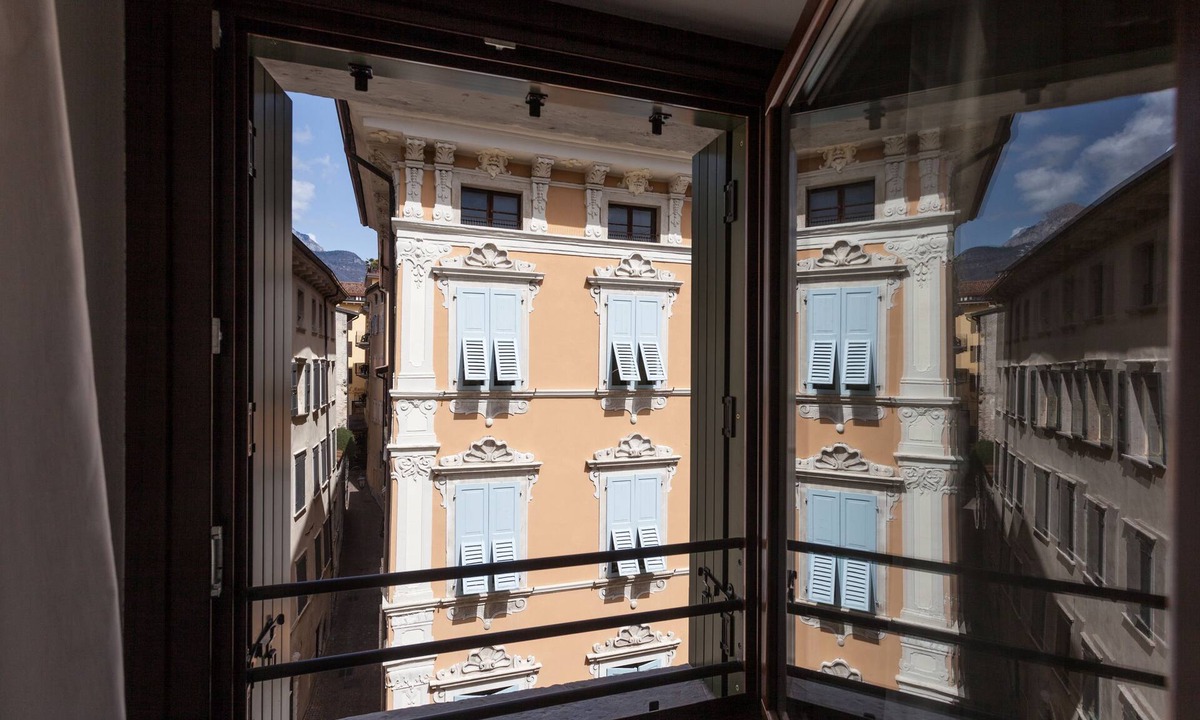 Riva del Garda Apartment | Modern, Centrally Located Apartment "RivApartmentsDowntowN - Love" with a View of the Old Town of Riva del Garda, A/C & Wi-Fi