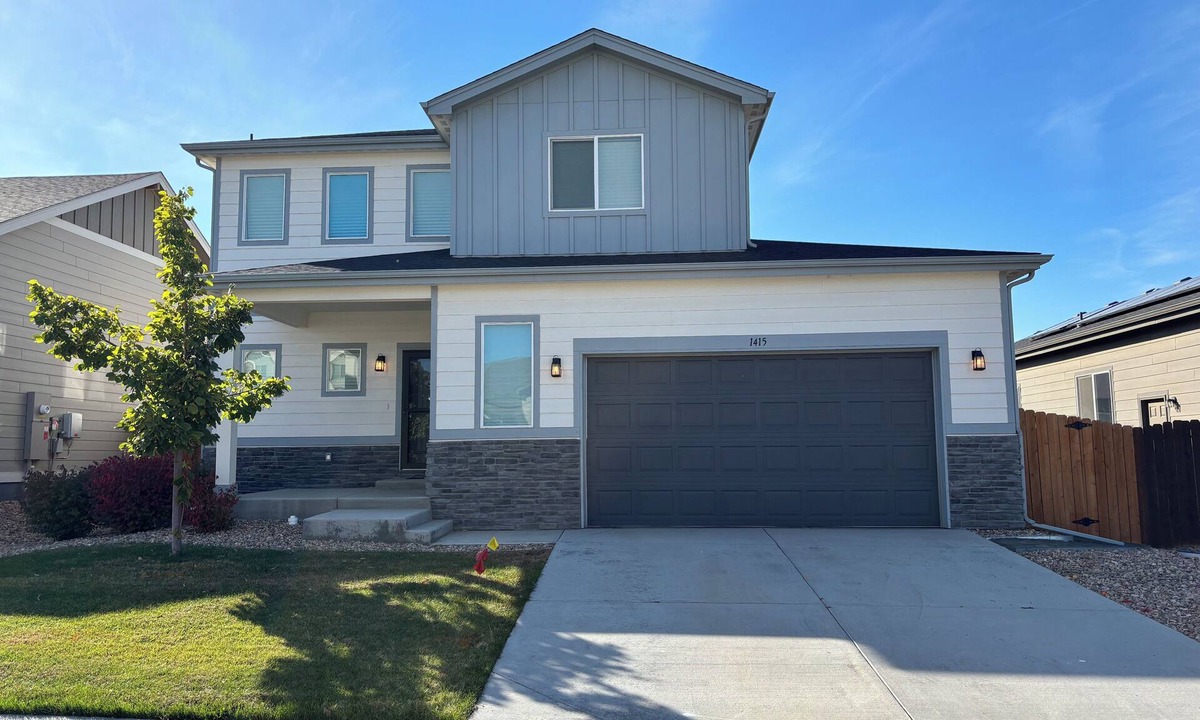 Milliken House | Modern home with a large fenced yard, and garage access