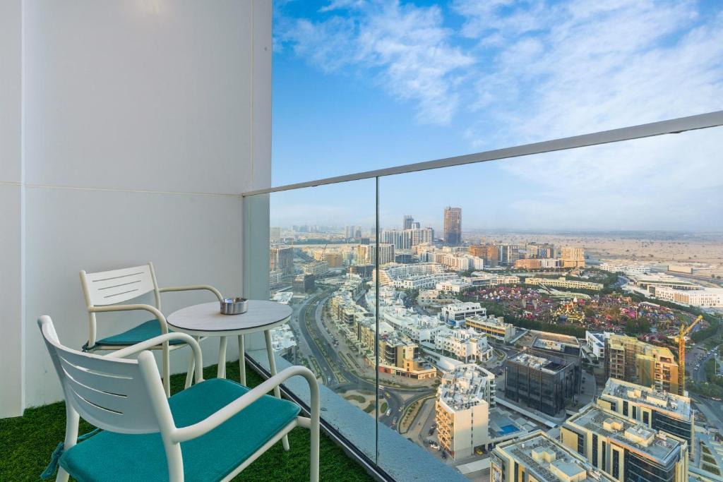 Al Barsha Apartment | Modern Studio on 27th Floor with Miracle Garden Views