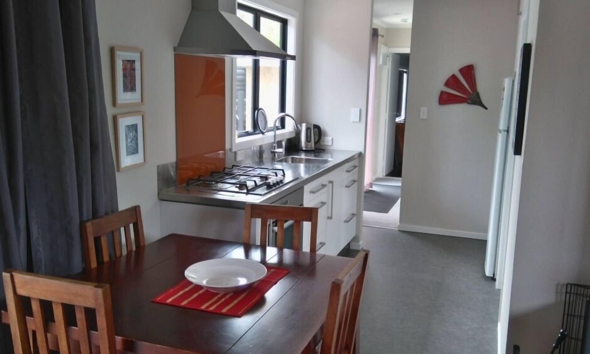 Waitarere Beach House | Now with unlimited fibre broadband! Warm,2 bedroom bach in quiet,sunny location.