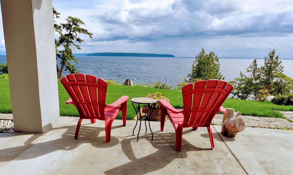 Sliammon House | Oceanfront Getaway: Sunsets, Sauna & Hot Tub w 180 views. Tropical Garden Oasis.