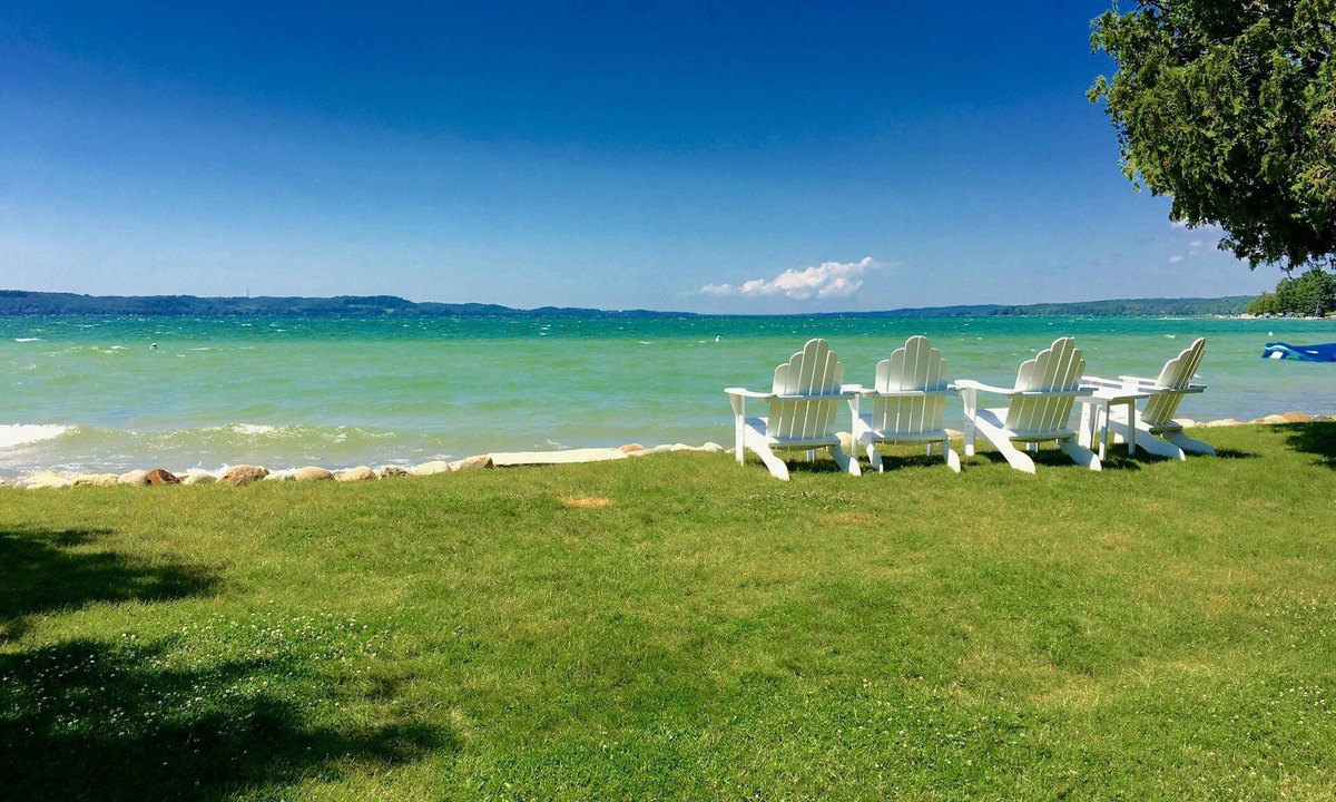 Clam River Cottage | ON TORCH LAKE - SUNSETS - LG SANDY BEACH & YARD - PERFECT FOR FAMILIES BOOK 2027