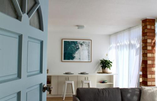 Forster House | One Mile Studio - 70s style ocean escape