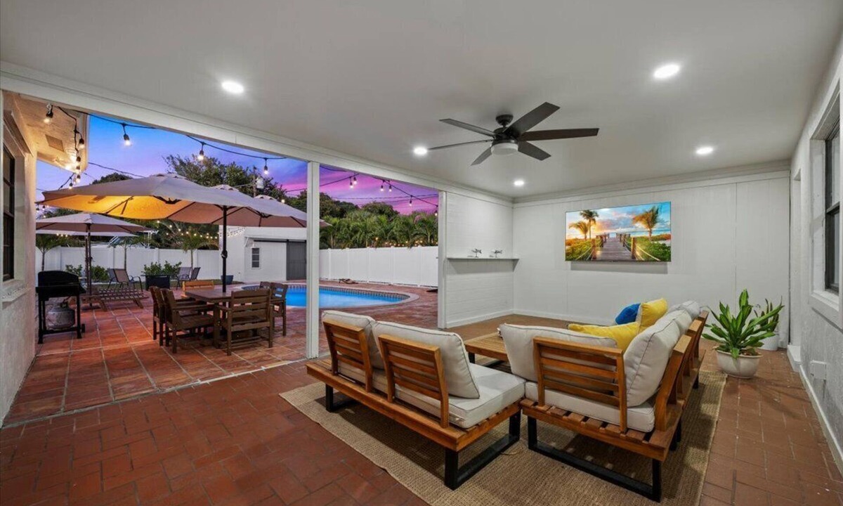 Lake Clarke Shores House | Palm Blanc- Modern Retreat Pool Firepit