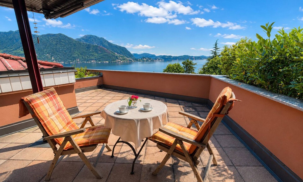 Susello Apartment | Panorama studio with 40 m² sunny balcony, pool & fantastic view of Lake Maggiore