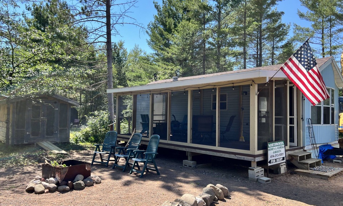 Boulder Junction Cabin | Parkmodel cabin w screened porch in campground on bike trail.