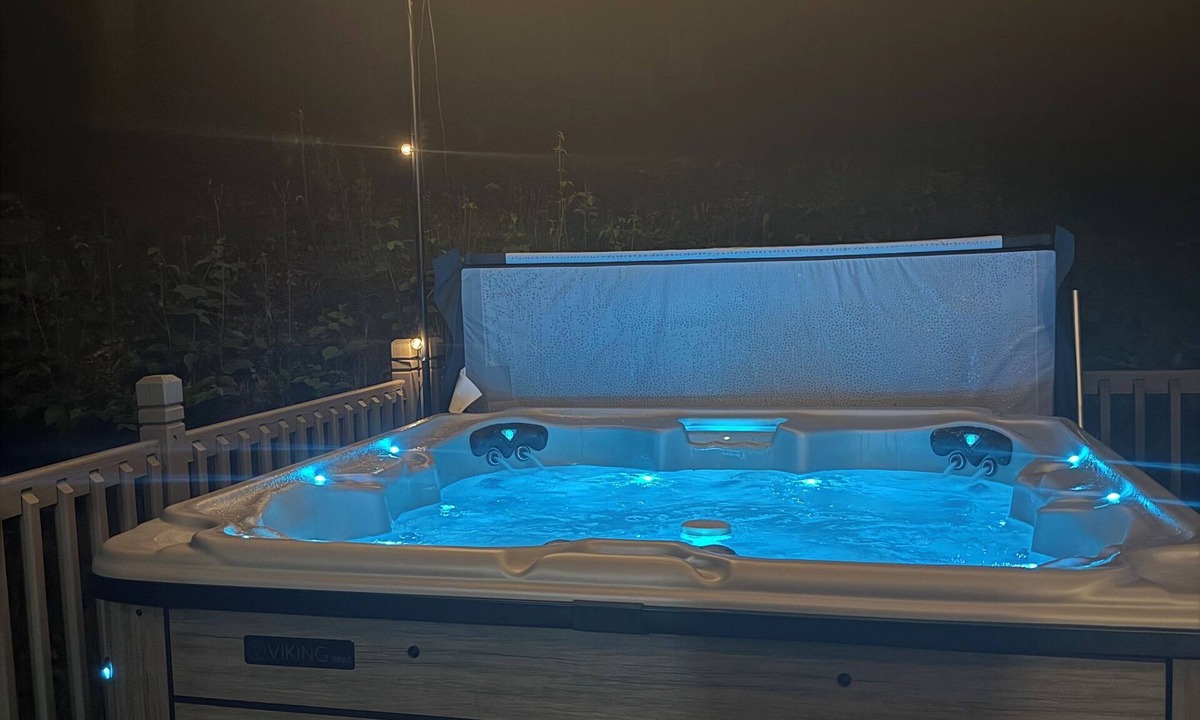 Walloon Lake Cabin | Peaceful cabin hideaway with fire pit & hot tub only 3 blocks from Walloon Lake