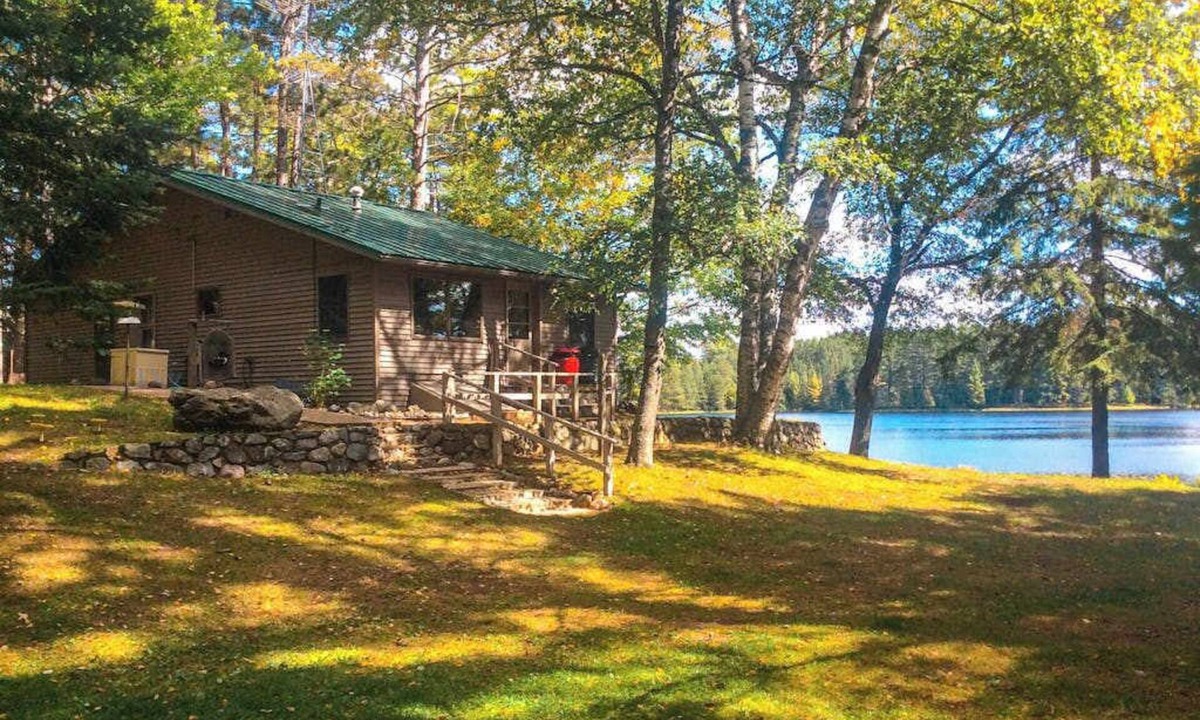 Rhinelander House | Peaceful, quiet lakefront dog-friendly cabin w/fishing dock, boats, campfire pit