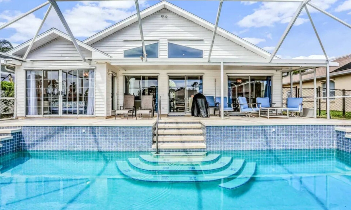 Palm Harbor House | Peaceful Waterfront Pool Home by RedAwning