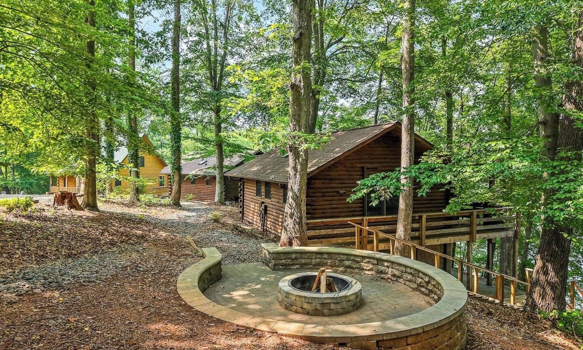 Union Hall Cabin | Perched privately on a bluff with breathtaking sunrise views over Smith Mountain Lake, this cozy remodeled 2BR/1BA log cabin offers queen memory-foam beds, well-stocked granite kitchen (farm-fresh eggs!), covered deck, stone fire pit, huge dock.