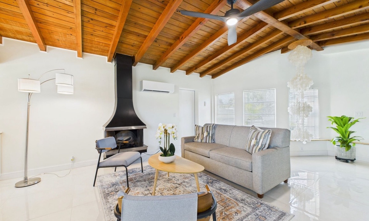 Surfside Estates House | Pet-friendly 3BR beachside home with fenced yard, hot tub, Green Egg grill, and beach gear! Walk to the ocean and relax in your private coastal backyard oasis.