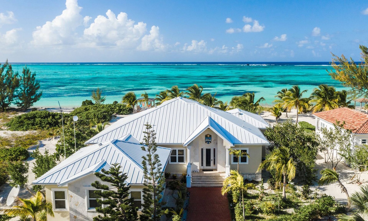 Whitby House | Private Beachfront Luxury Estate pool with waterfall free concierge – Sleeps 16