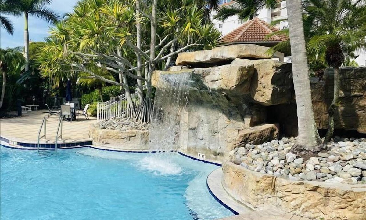 Vanderbilt Beach Condo | Private extended deck with steps down to the pool! - Reg 5-205