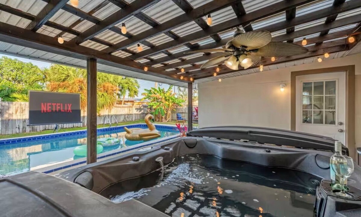 Cocoa Isles House | Private Pool + Hot Tub + Outdoor Movie Nights — Relax in your own backyard oasis with a heated pool, spa, fire pit, and fire up the projector under the stars. Located in famous Cocoa Beach near Kennedy Space Center, Disney & Port Canaveral!