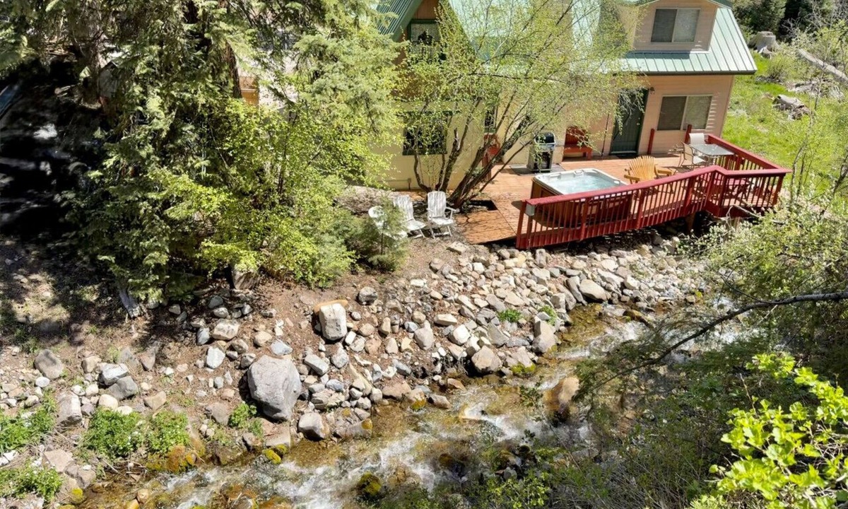 Sundance Cottage | Quiet streamside retreat Hot Tub Deck overlooking the creek Wood-burning stove Tucked below Sundance