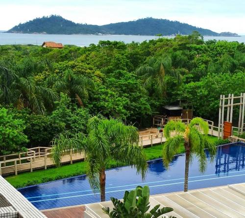 Campeche Norte Apartment | Refúgio VIP Pé na Areia no Campeche - Piscina, Sauna e Academia até 08 pessoas
