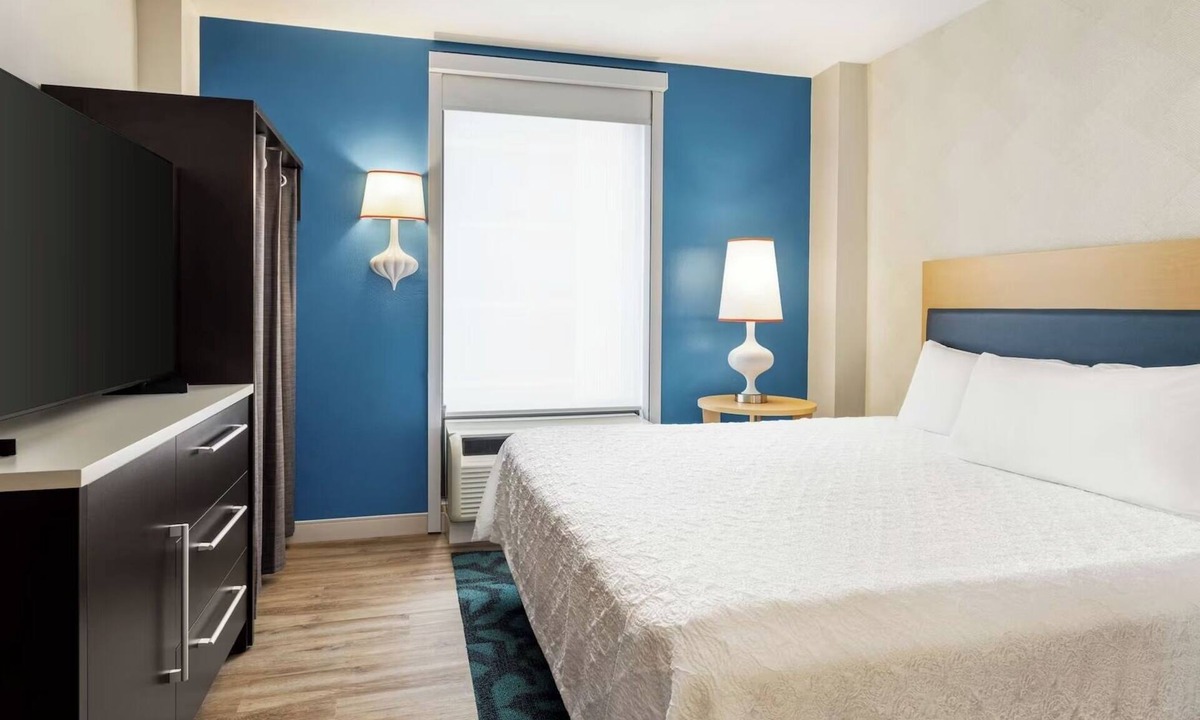 Queens Hotel | Refreshingly Stylish King Suite w/Expanded Bedroom Comfort & a Welcoming Lounge