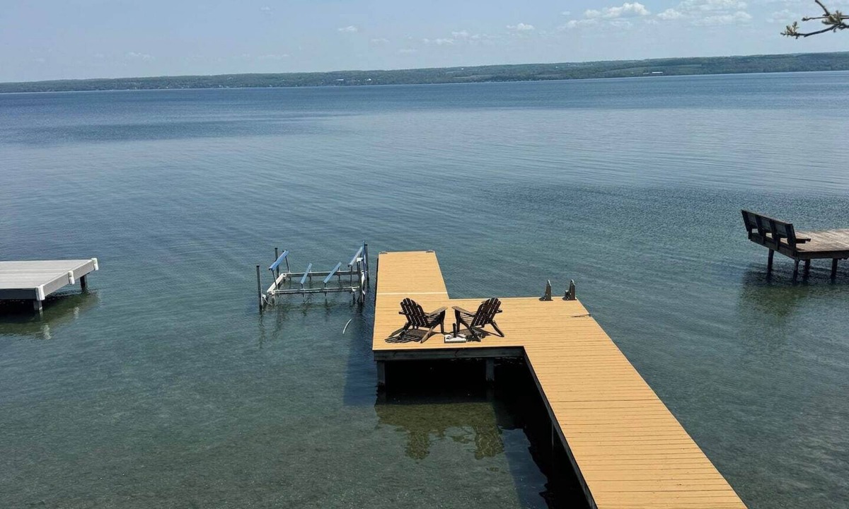 Romulus House | Relax at Poplar Beach Retreat on the sparkling waters of Cayuga Lake. This charming waterfront escape combines rustic character with bright, comfortable living spaces, creating the perfect setting for a relaxing Finger Lakes getaway.