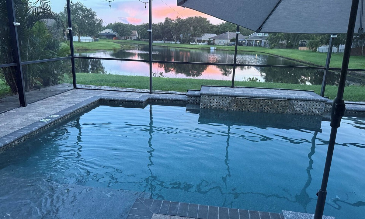 Riverview House | Relax in my calm and stylish space. Enjoy the relaxing lakeview and heated pool.