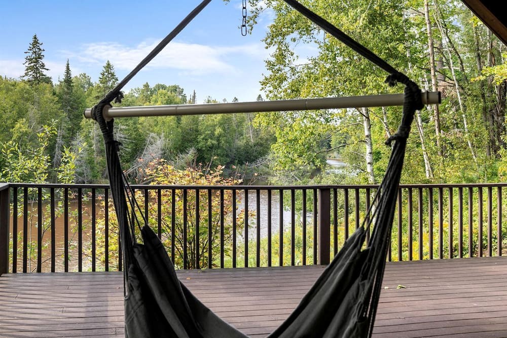 Hessel Cabin | Riverfront Cabin Incredible for Outdoor Enthusiasts with Kayaks in Hessel, Michigan