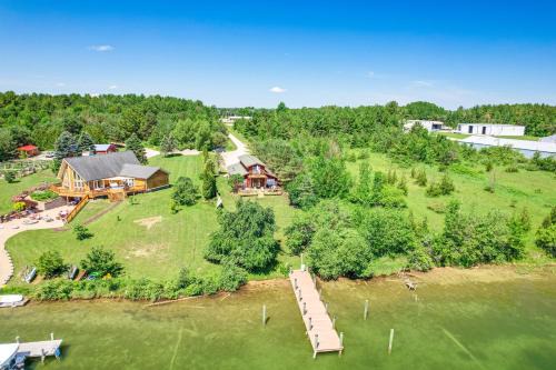 Cheboygan House | Riverfront Cheboygan Home w/Dock ~ 4 Mi to Town!