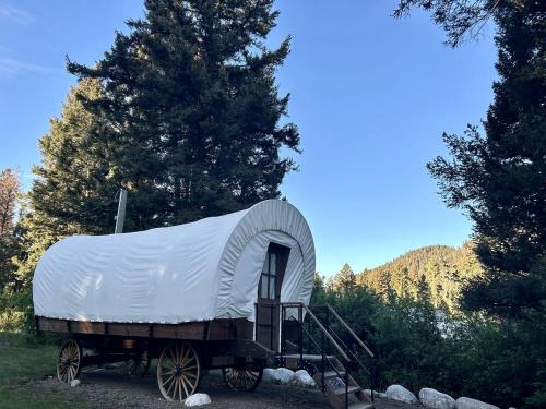 Granite County House | Rustic Conestoga Wagon Stay with Lodge Amenities near Boulder Creek, Montana