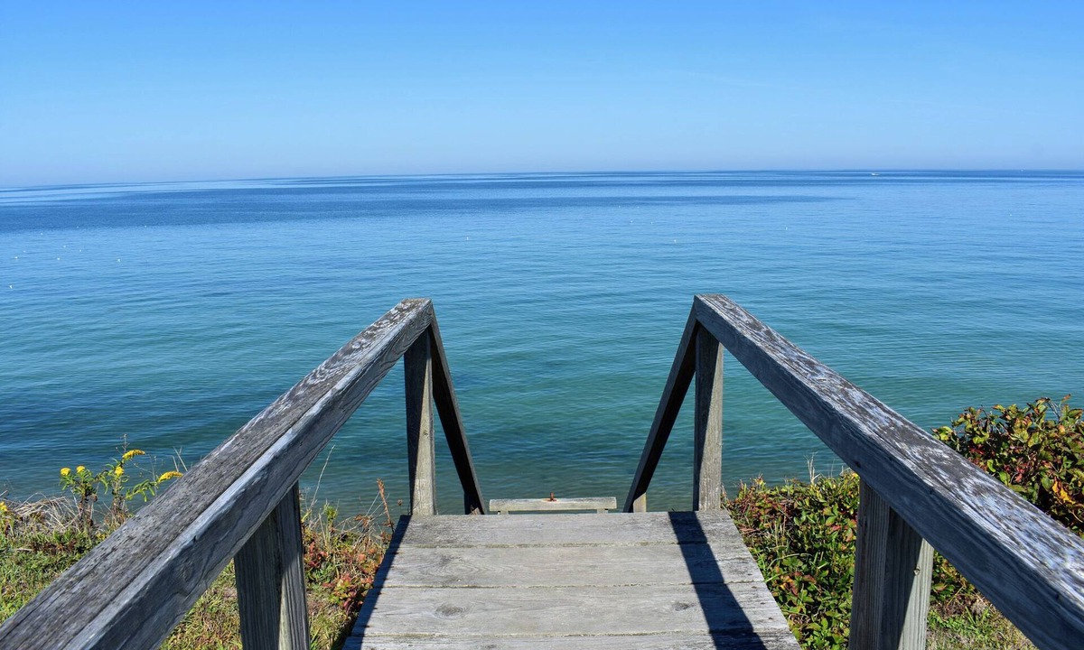 Dennis House | Rustic Oceanfront Retreat with Private Beach and Expansive Deck
