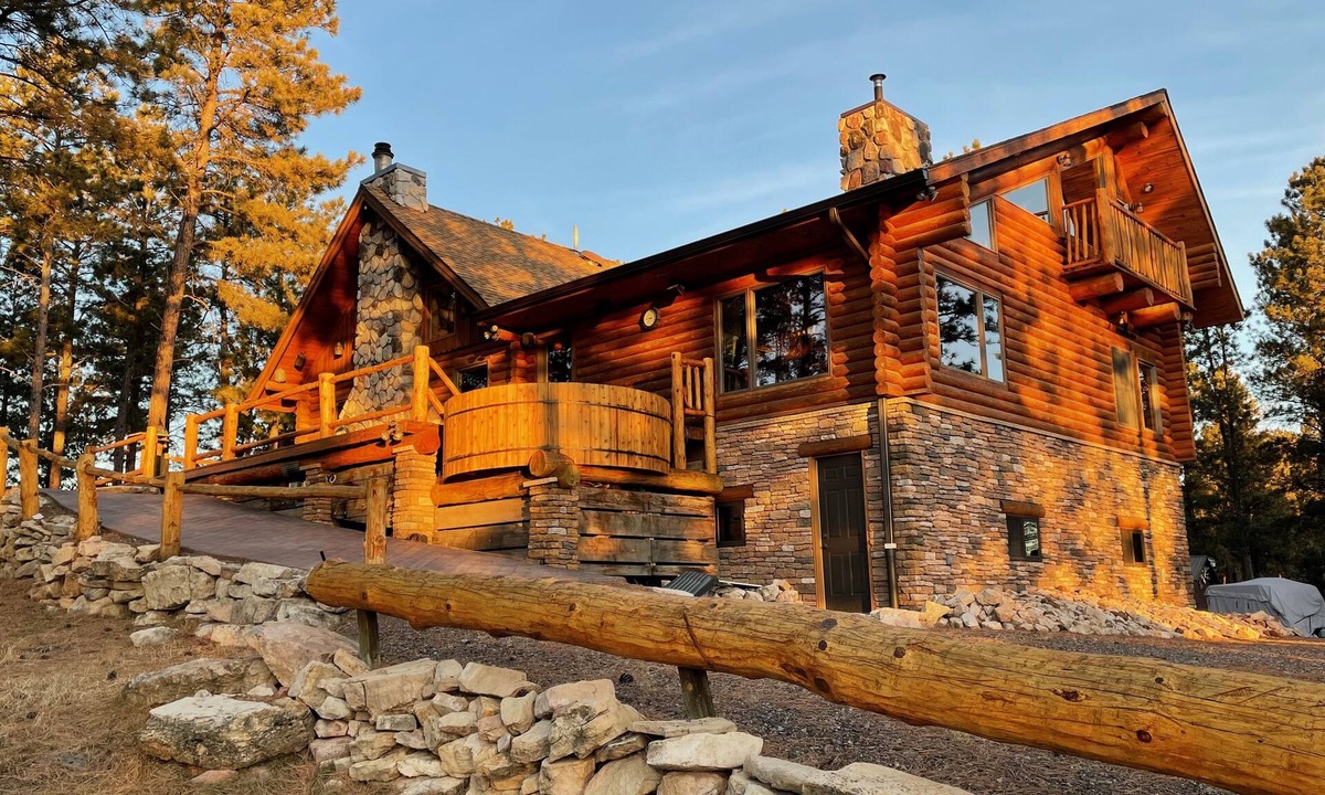 Rapid City House | Rustic, yet comfortable log home with hot tub, sauna, and wood-fired pizza oven.