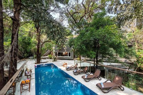 St.Stanislaus Villa Villa | SaffronStays Odeon - 4BR heritage art deco villa with cantilever pool, verandahs & forested lawns