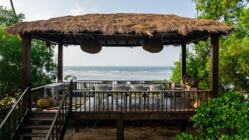 Redi Villa | SaffronStays Stella Maris Beach House - 5BR pet-friendly beachfront estate with yoga pavilion, luxury tents & private Redi Beach access