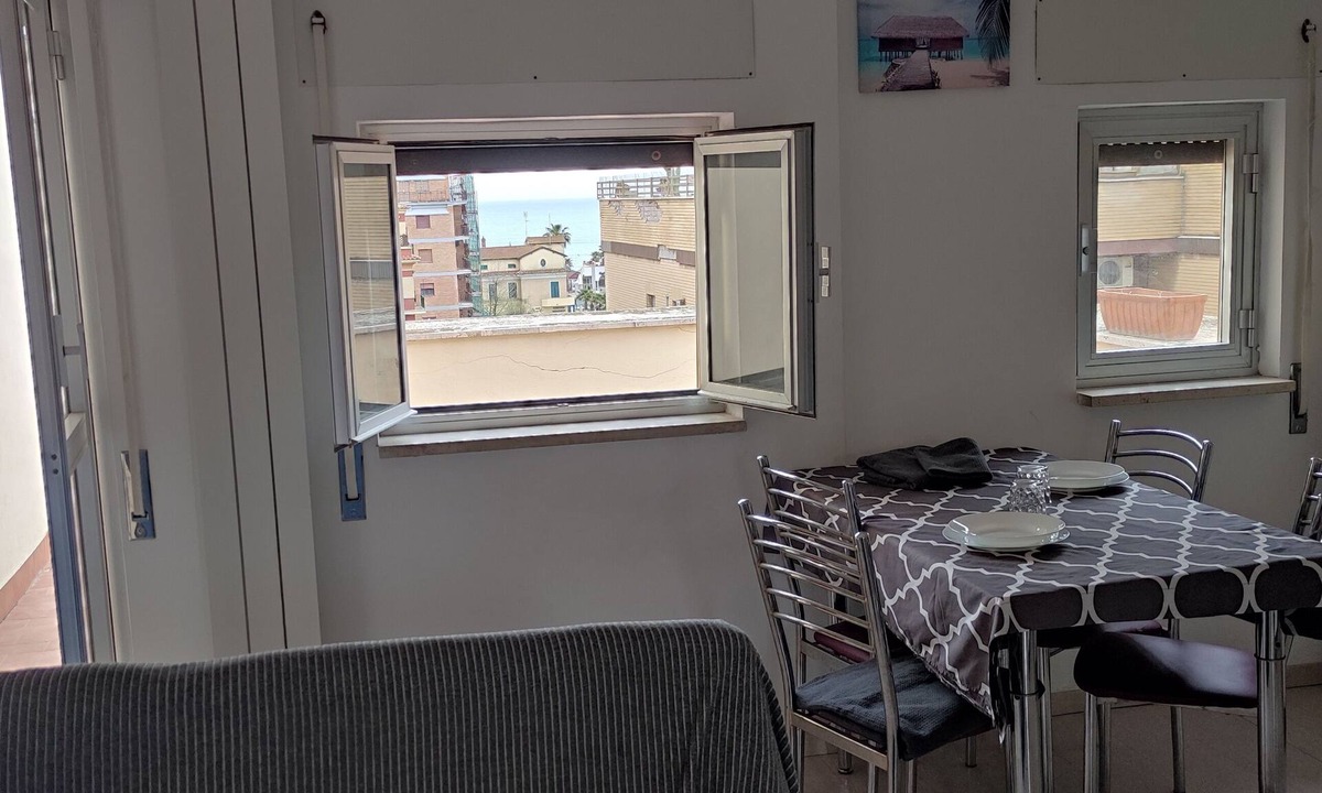 Quartiere XXXIII Lido di Ostia Ponente Apartment | Sea view terrace 300 meters from the beach. and for the winter the fireplace.