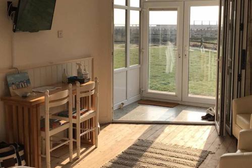 West Bay Apartment | Seaside Studio right on the coastal path.