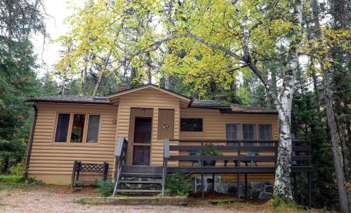 Babbitt House | Secluded Creekside Cabin with Screened Porch Near the Marina in Babbitt, Minnesota